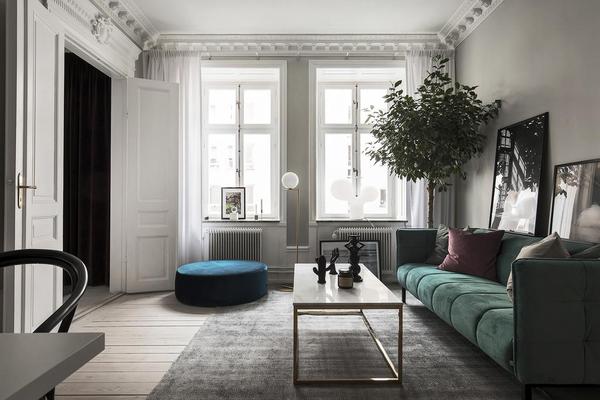 Stockholm Apartment with Gorgeous Green Sofa 