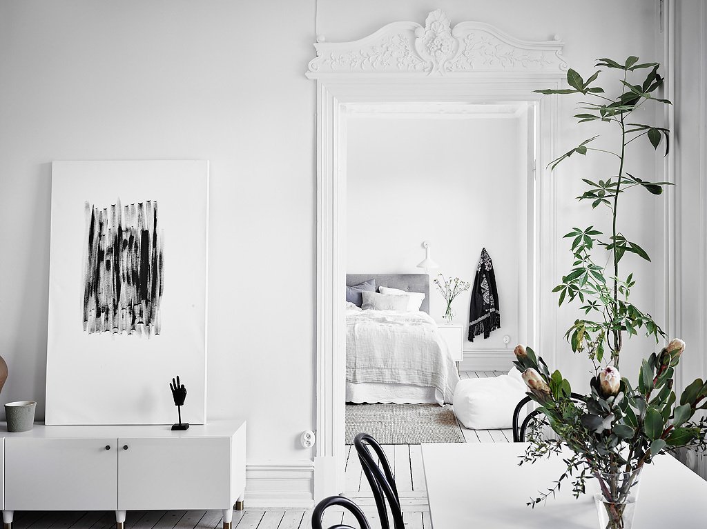 View to the bedroom from the dining area in classic Swedish apt